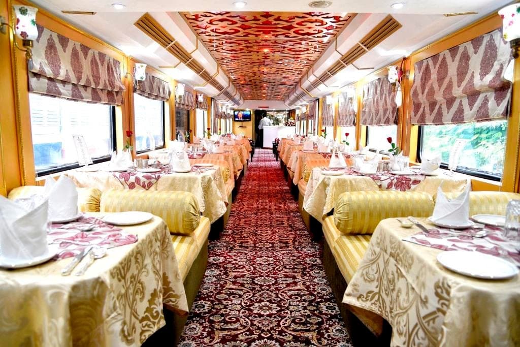 Palace on Wheels dining car with maroon and gold royal interior