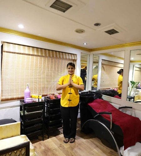 Palace on Wheels spa staff member welcoming guests onboard